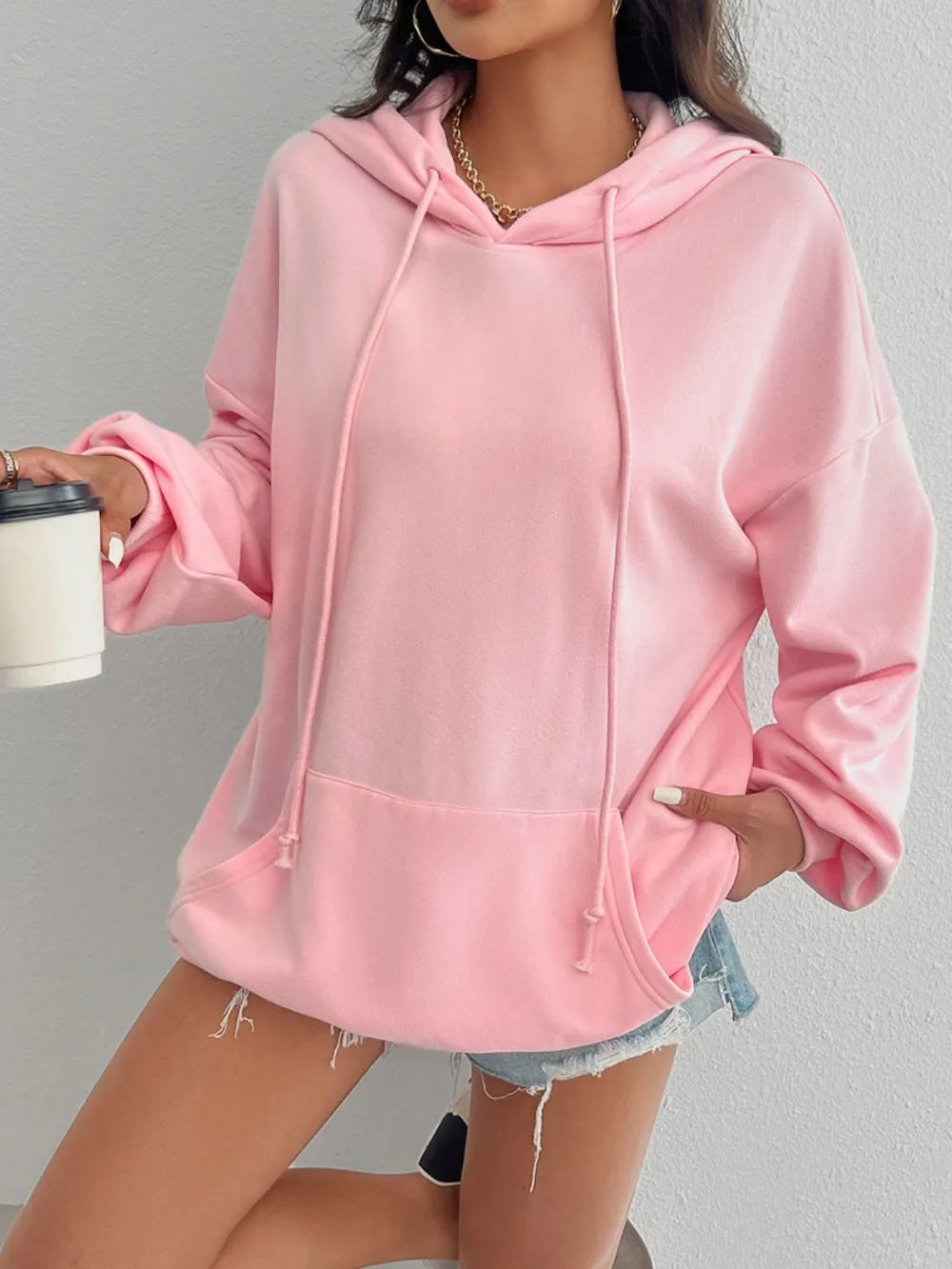 Drawstring long sleeve hoodie with pockets.