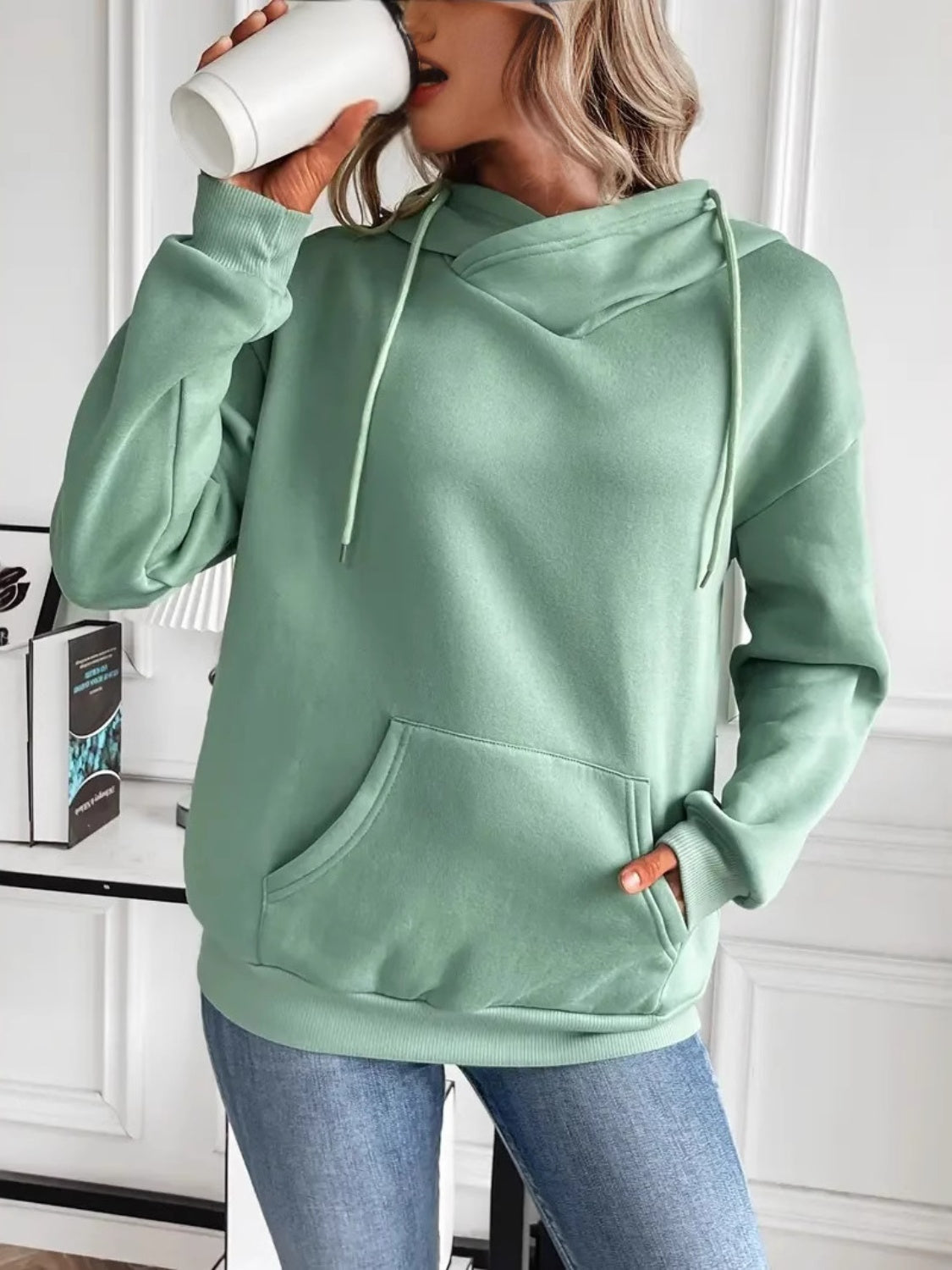 Drawstring long sleeve hoodie with kangaroo pocket.