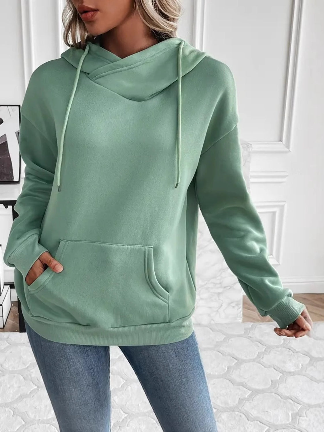 Drawstring long sleeve hoodie with kangaroo pocket.
