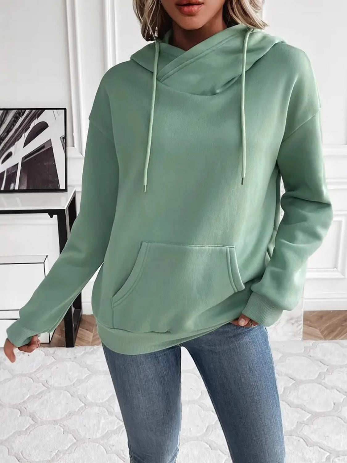 Drawstring long sleeve hoodie with kangaroo pocket.