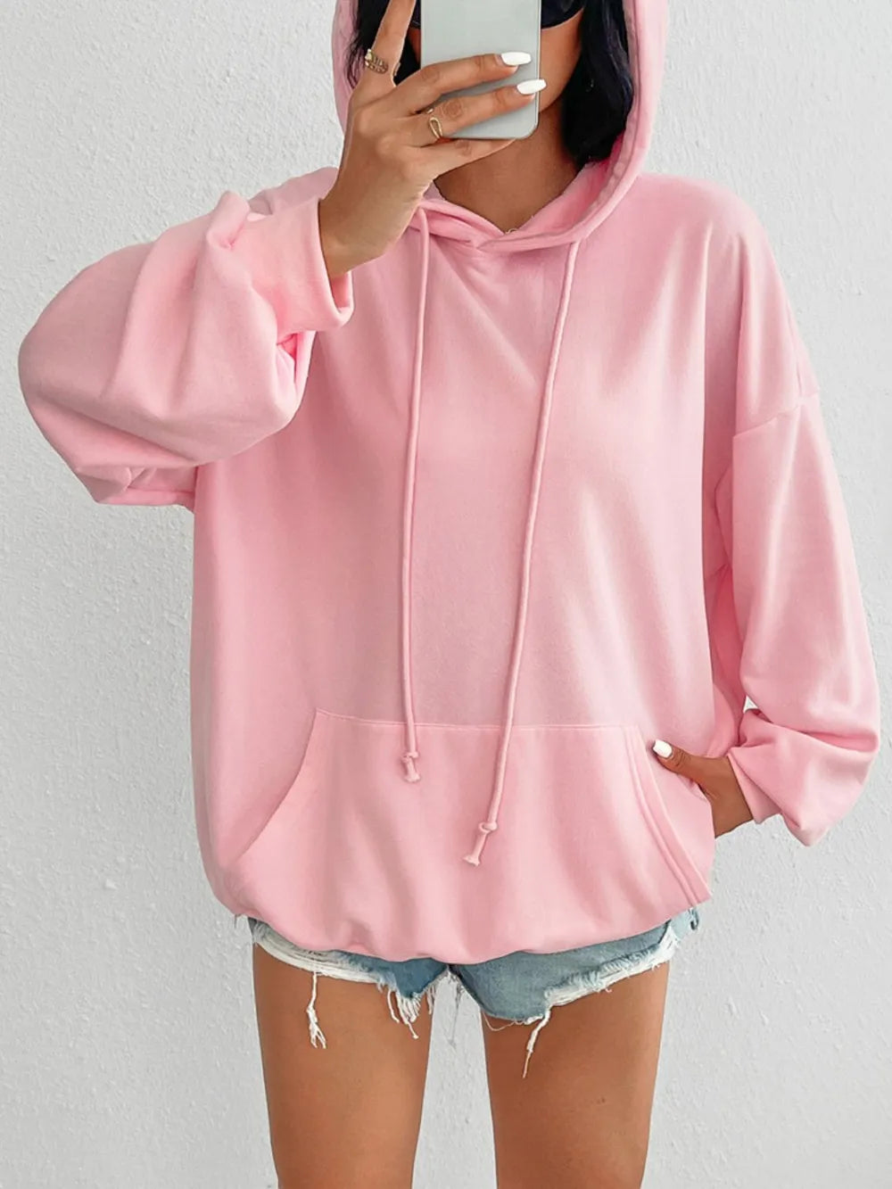 Drawstring long sleeve hoodie with pockets.