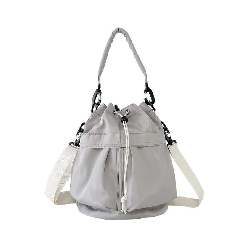 Medium nylon drawstring bucket bag.