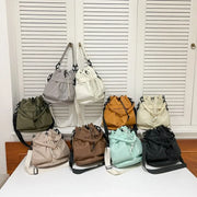 Medium nylon drawstring bucket bag.