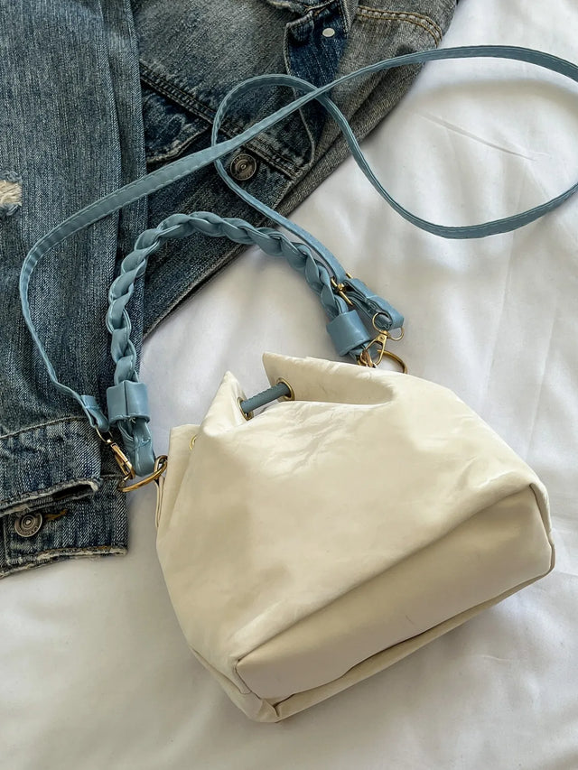 Small PU leather drawstring bucket bag.