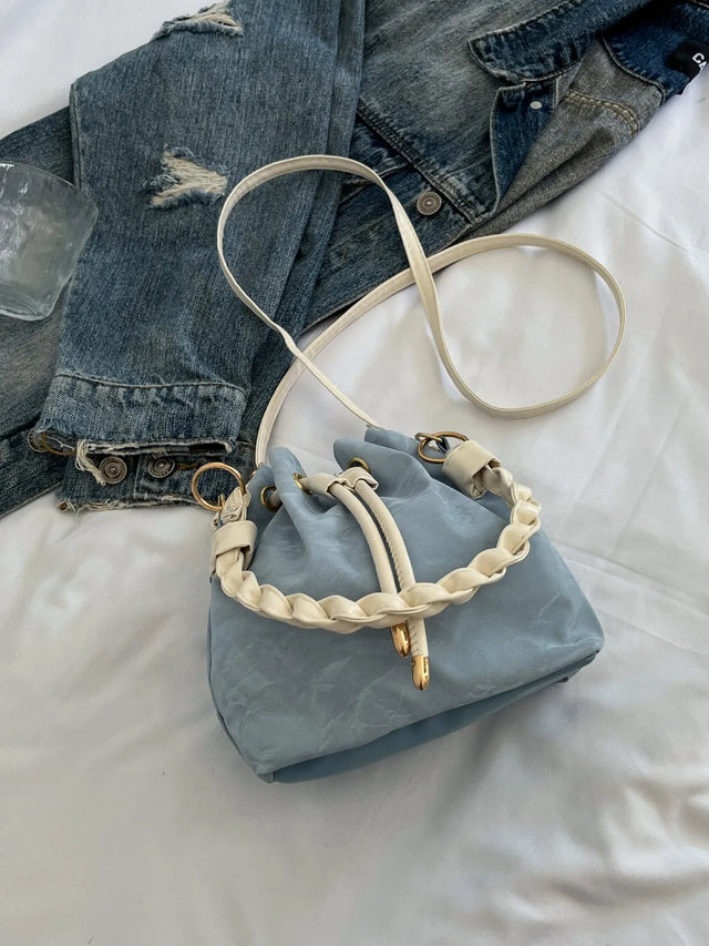 Small PU leather drawstring bucket bag.