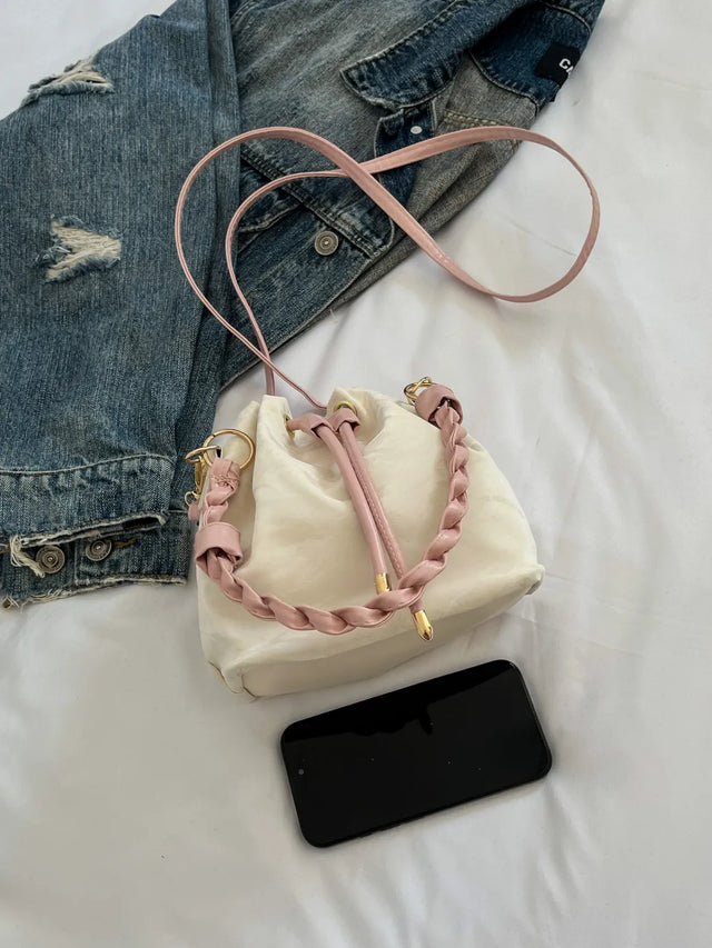 Small PU leather drawstring bucket bag.