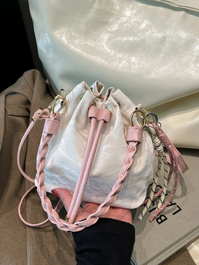 Small PU leather drawstring bucket bag.