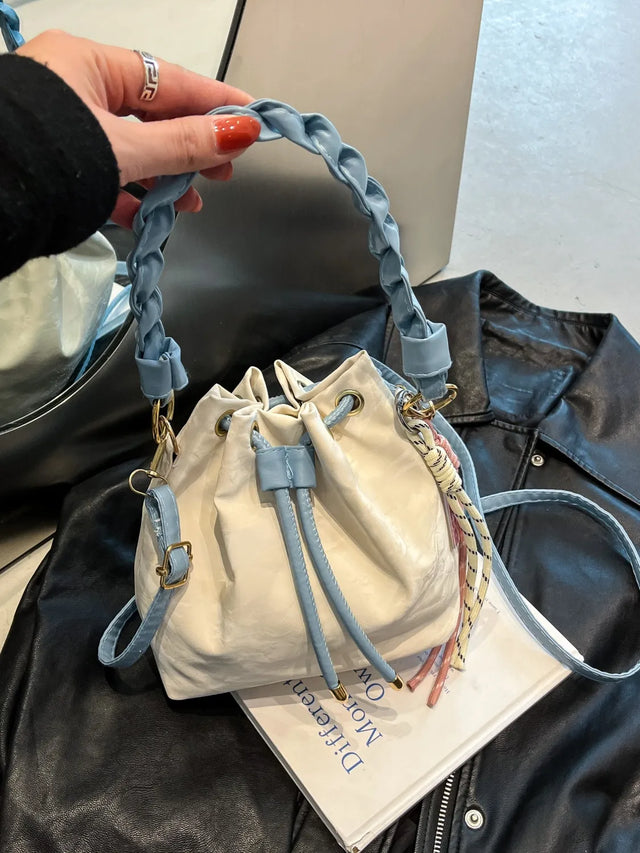 Small PU leather drawstring bucket bag.