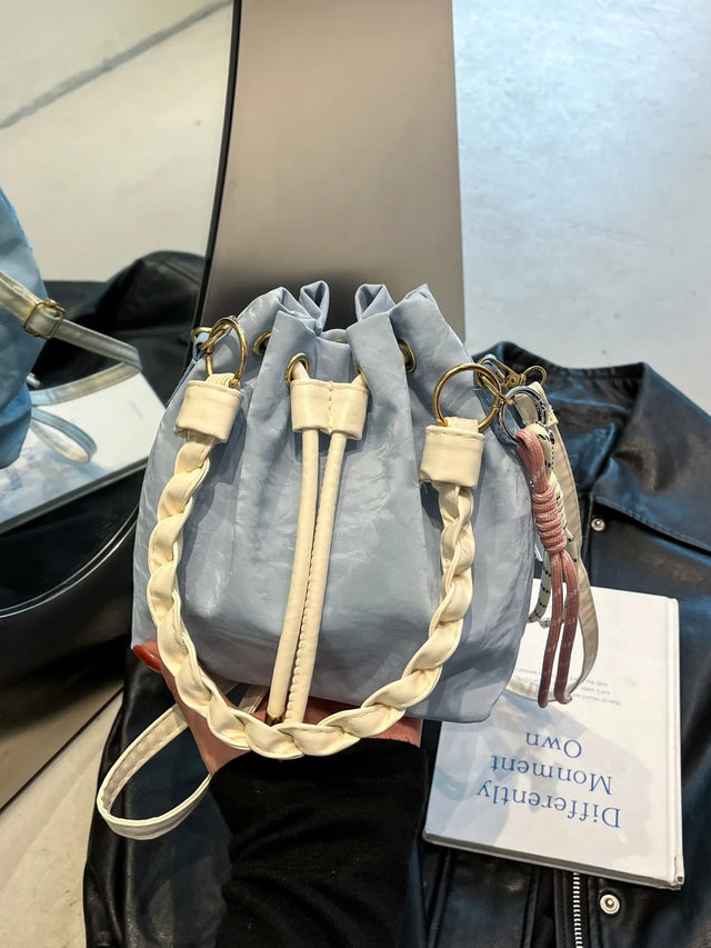 Small PU leather drawstring bucket bag.