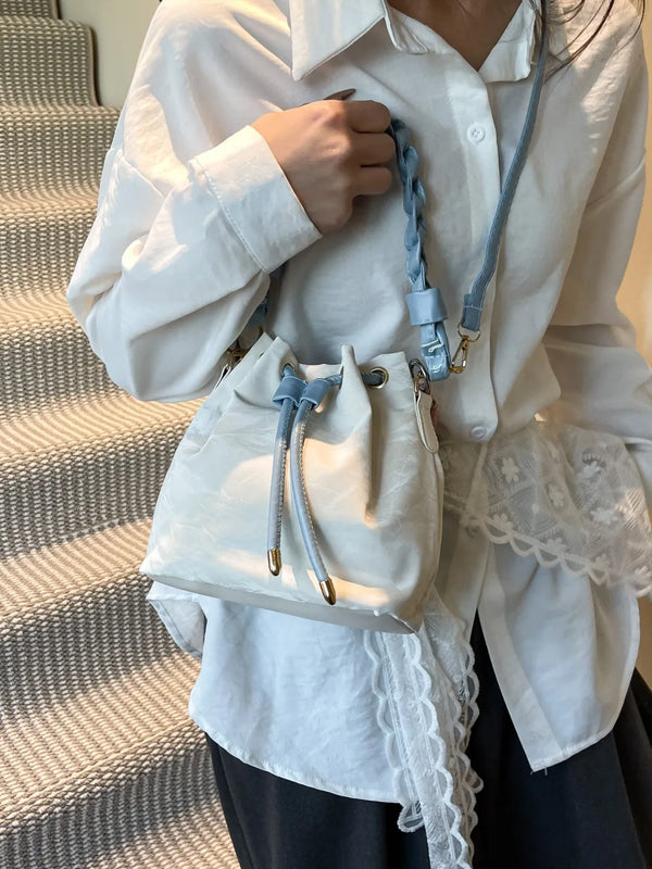 Small PU leather drawstring bucket bag.