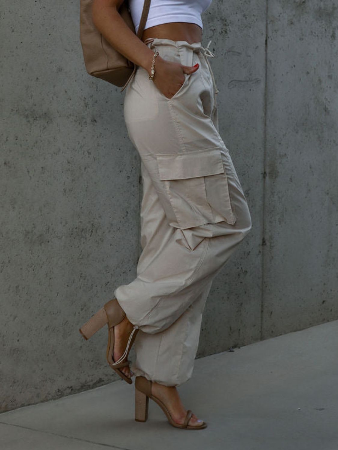 Drawstring pants with pockets, opaque.