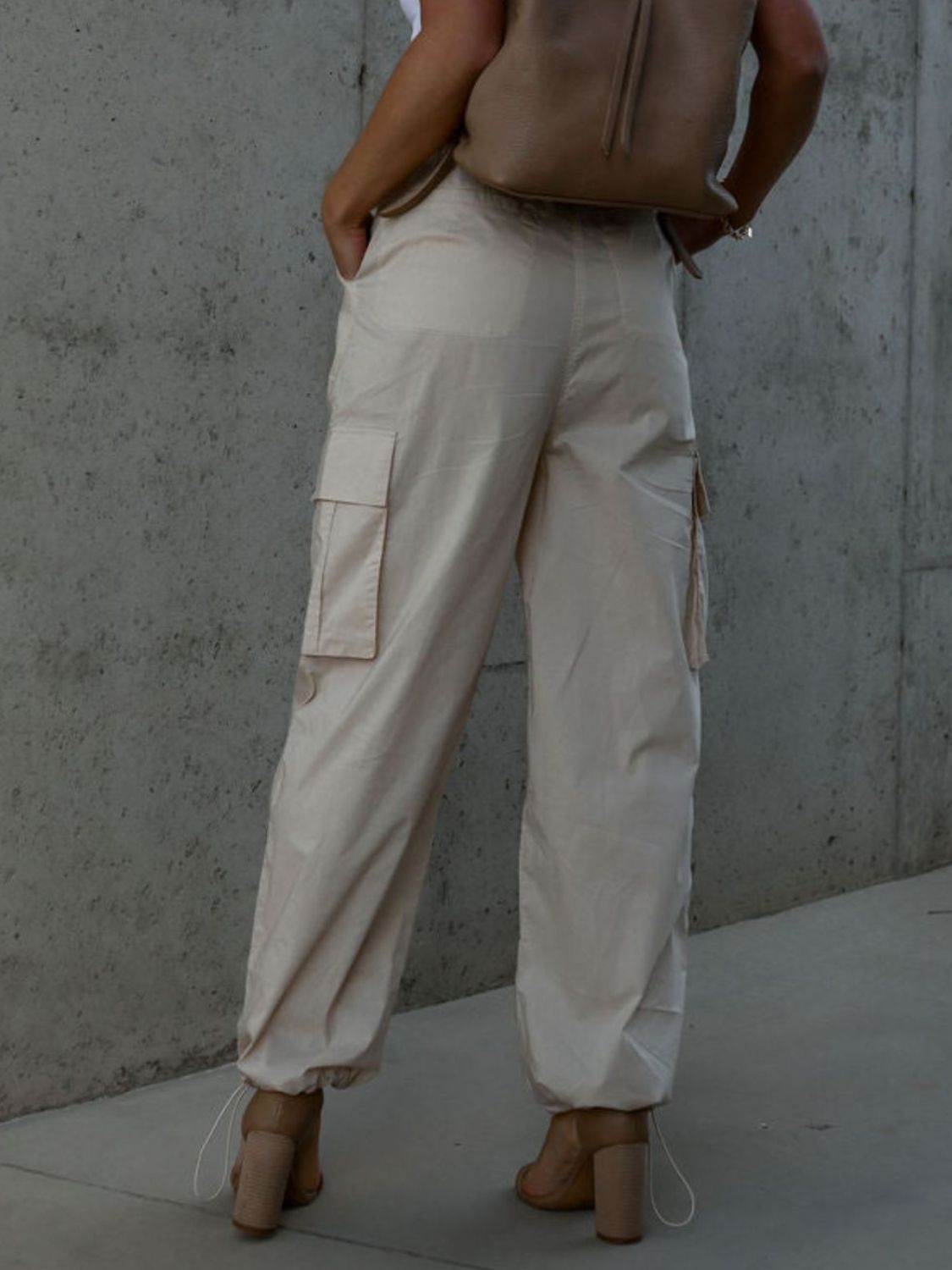 Drawstring pants with pockets, opaque.