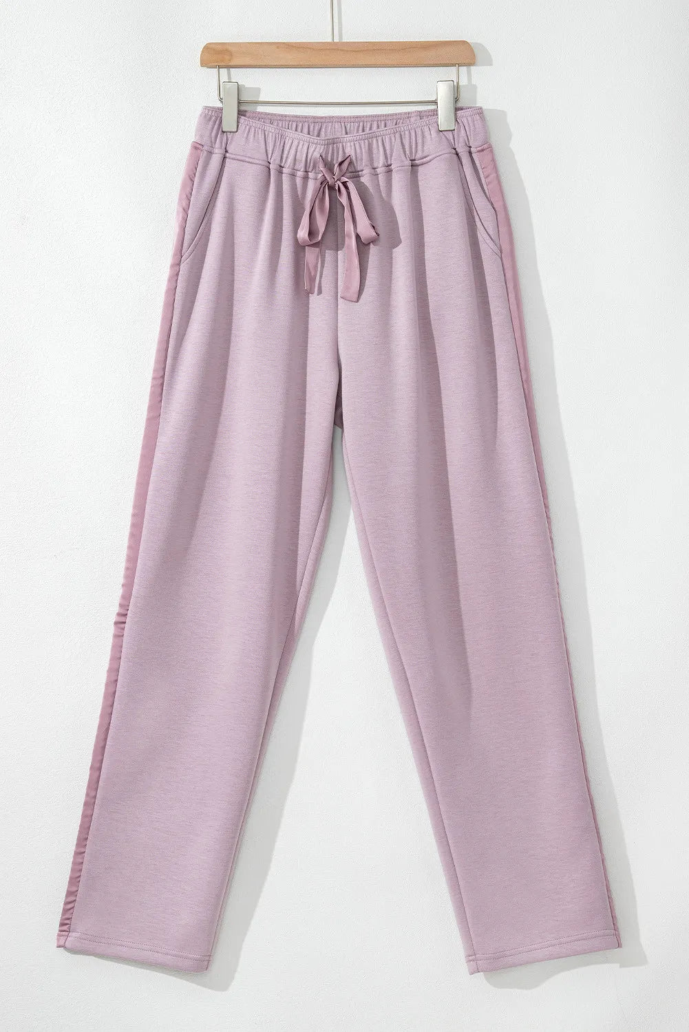 Drawstring pants with pockets, opaque.