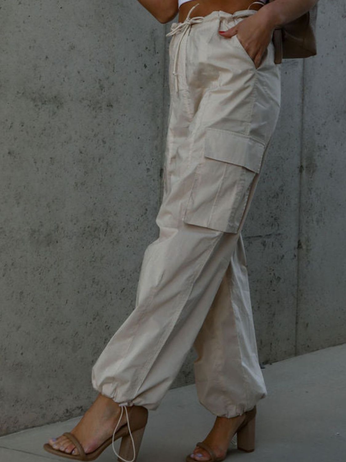Drawstring pants with pockets, opaque.