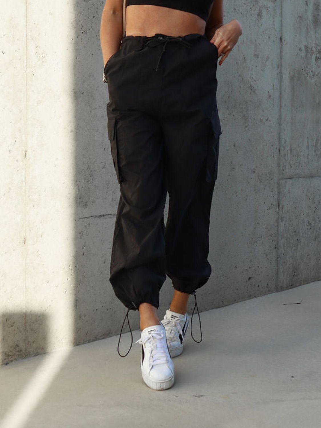 Drawstring pants with pockets, opaque.