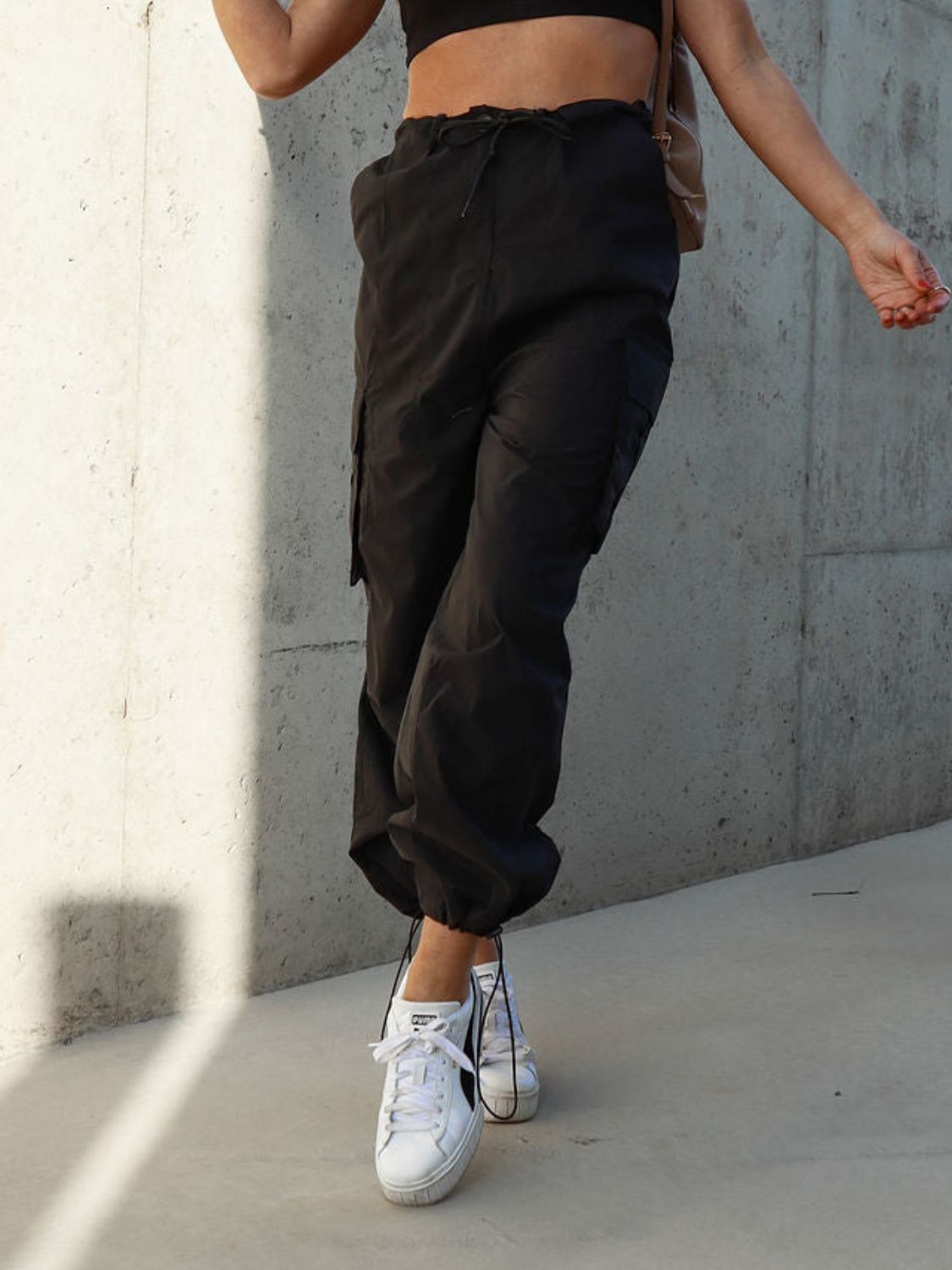 Drawstring pants with pockets, opaque.