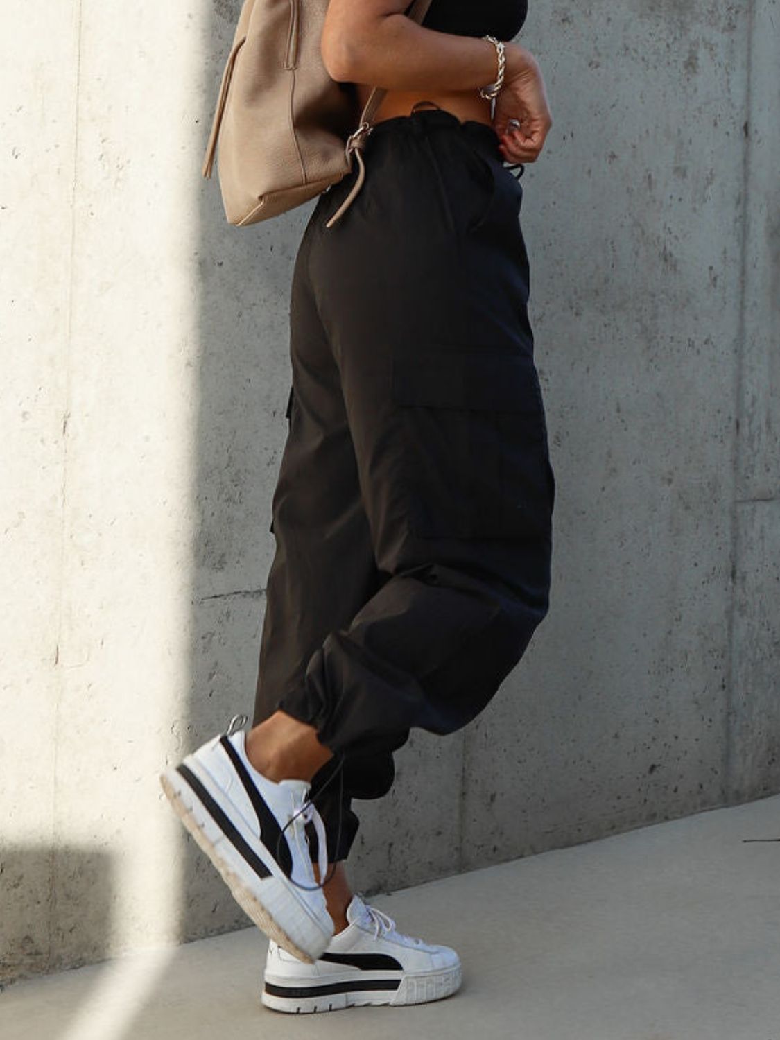 Drawstring pants with pockets, opaque.