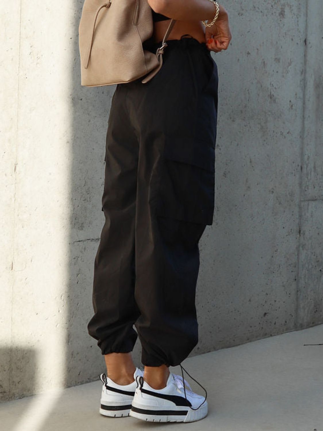 Drawstring pants with pockets, opaque.