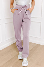 Drawstring pants with pockets, opaque.