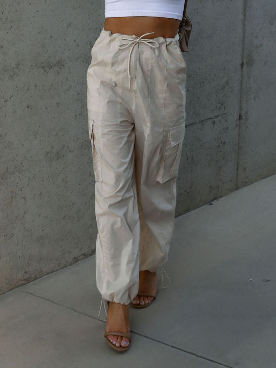 Drawstring pants with pockets, opaque.