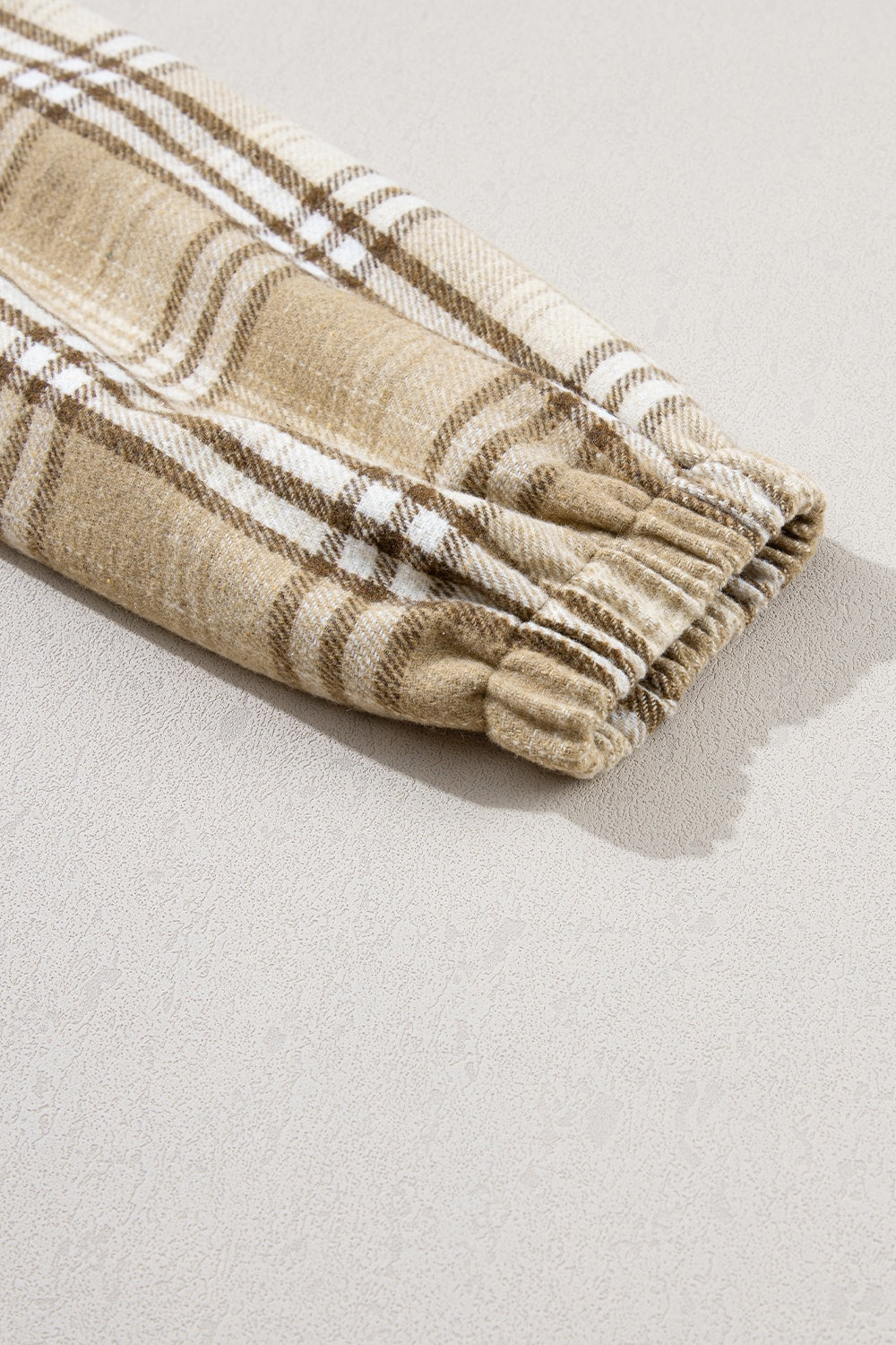 Drawstring plaid half zip raglan sleeve hoodie with pockets.