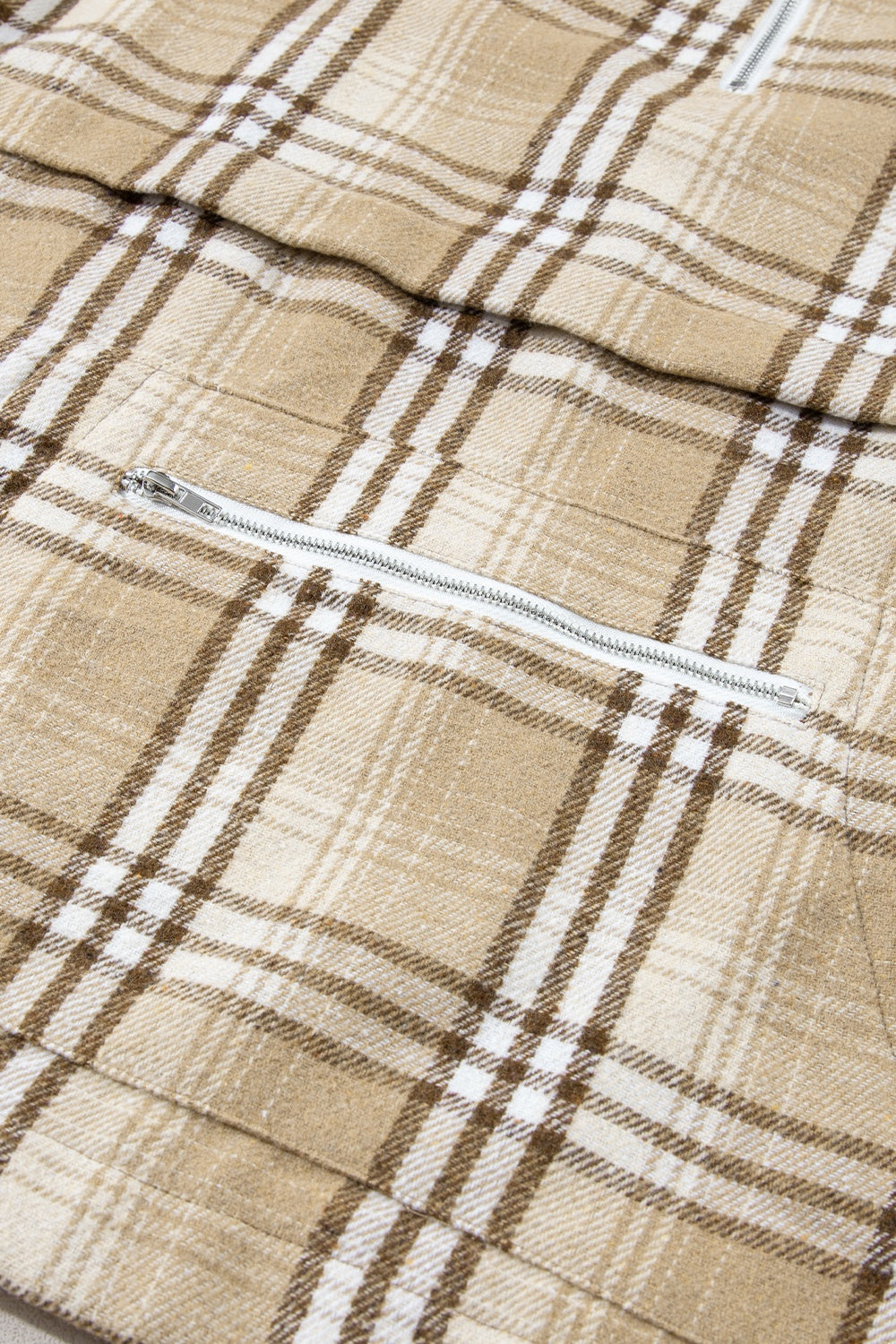 Drawstring plaid half zip raglan sleeve hoodie with pockets.