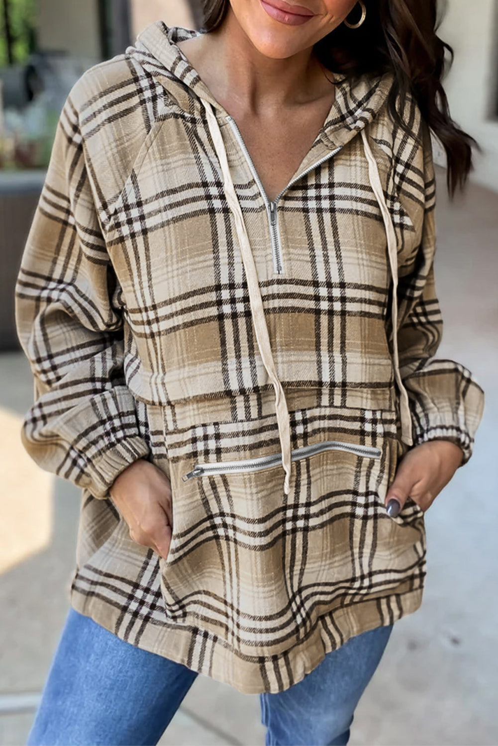 Drawstring plaid half zip raglan sleeve hoodie with pockets.