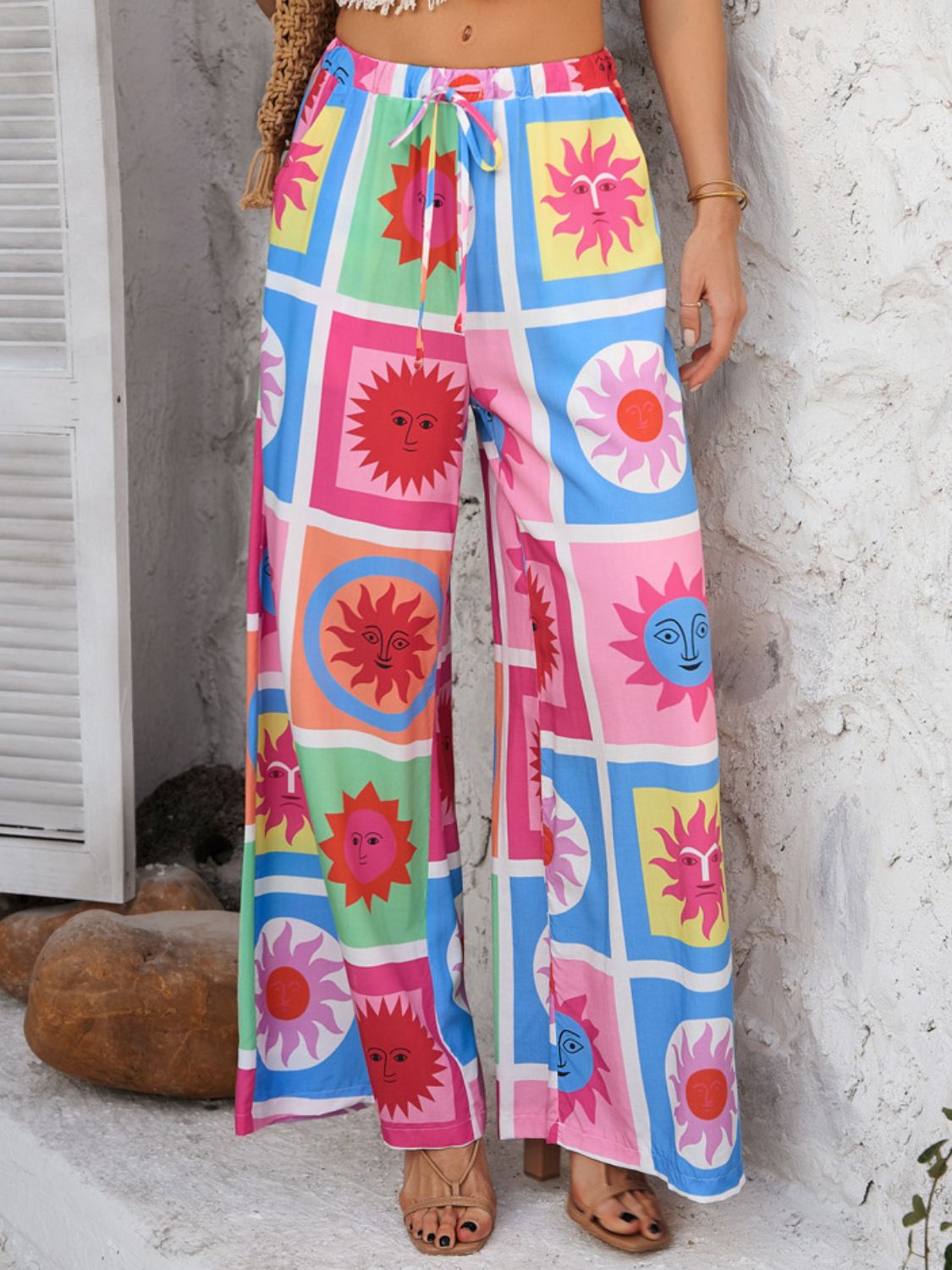 Drawstring printed wide leg pants with pockets, opaque.
