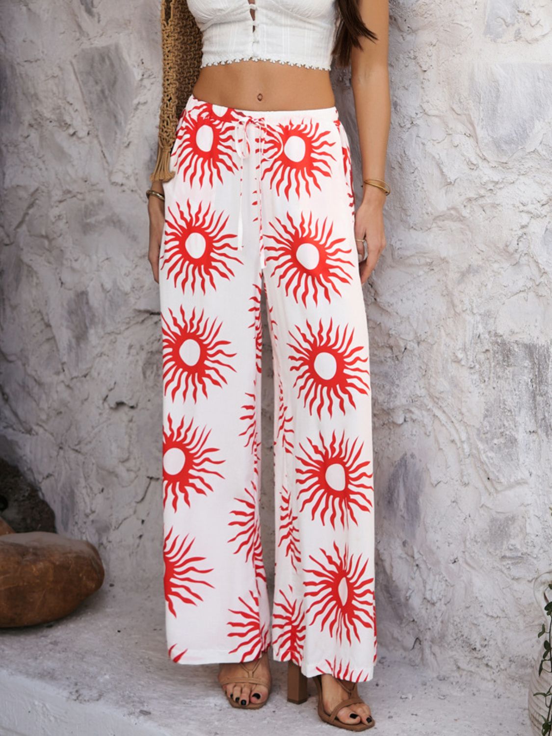 Drawstring printed wide leg pants with pockets, opaque.
