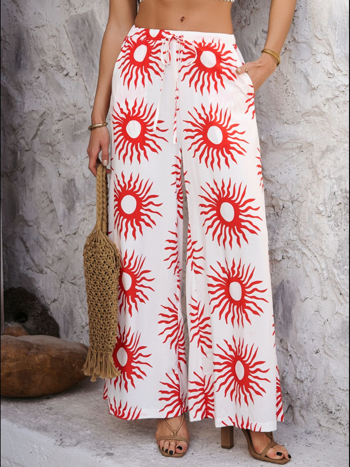 Drawstring printed wide leg pants with pockets, opaque.