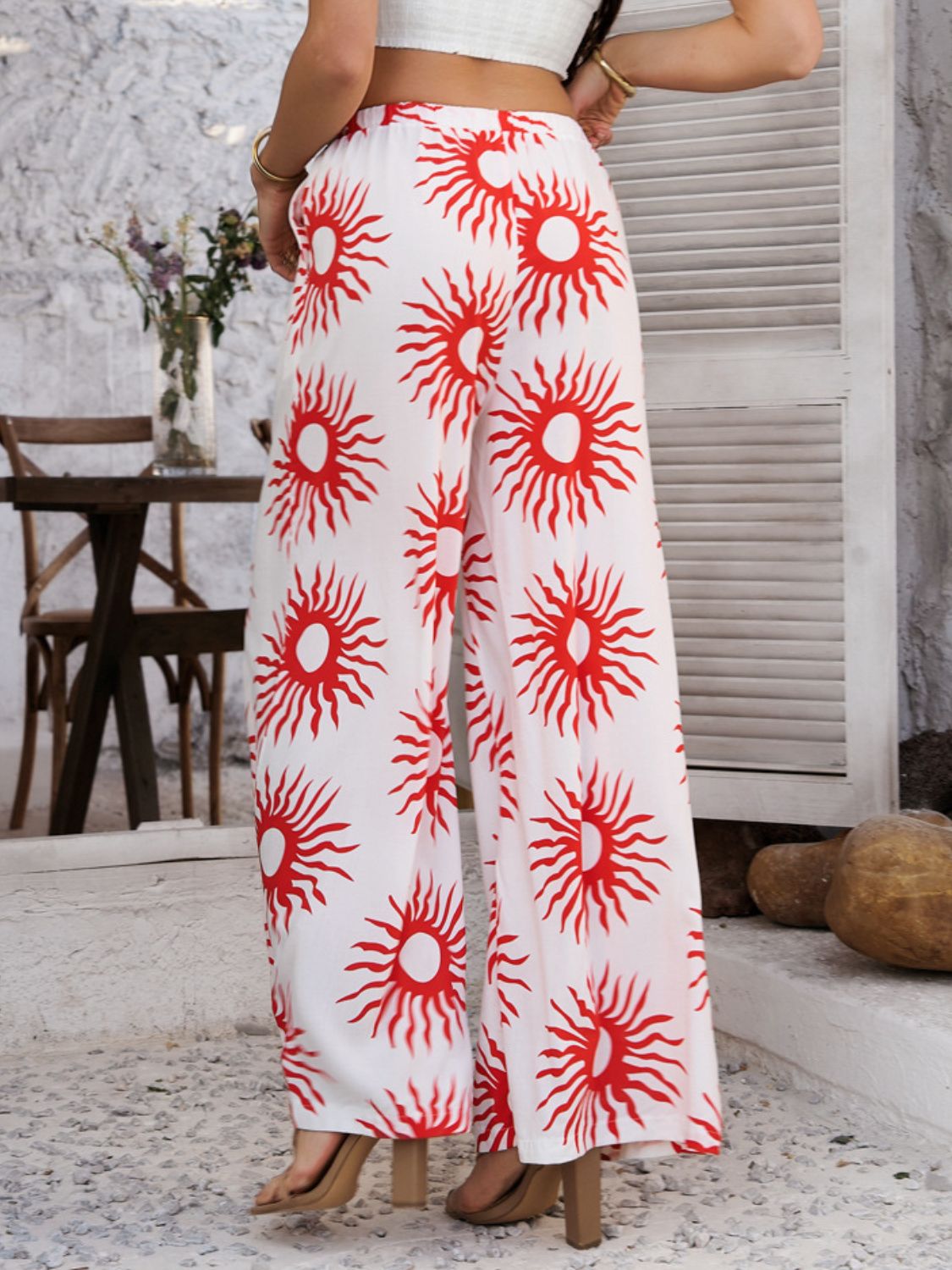 Drawstring printed wide leg pants with pockets, opaque.