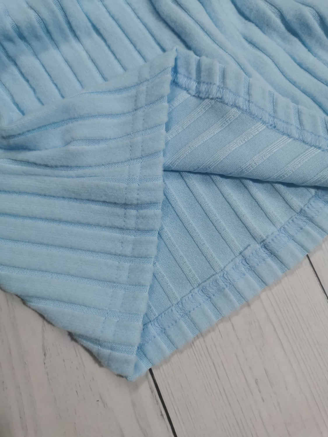 Drawstring ruched long sleeve ribbed top.