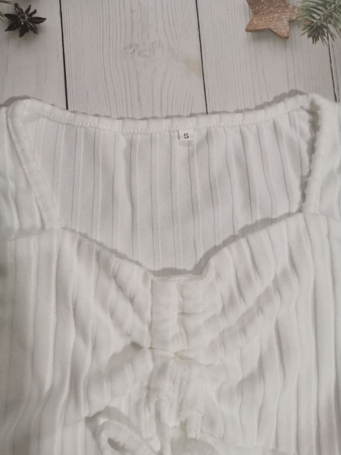 Drawstring ruched long sleeve ribbed top.