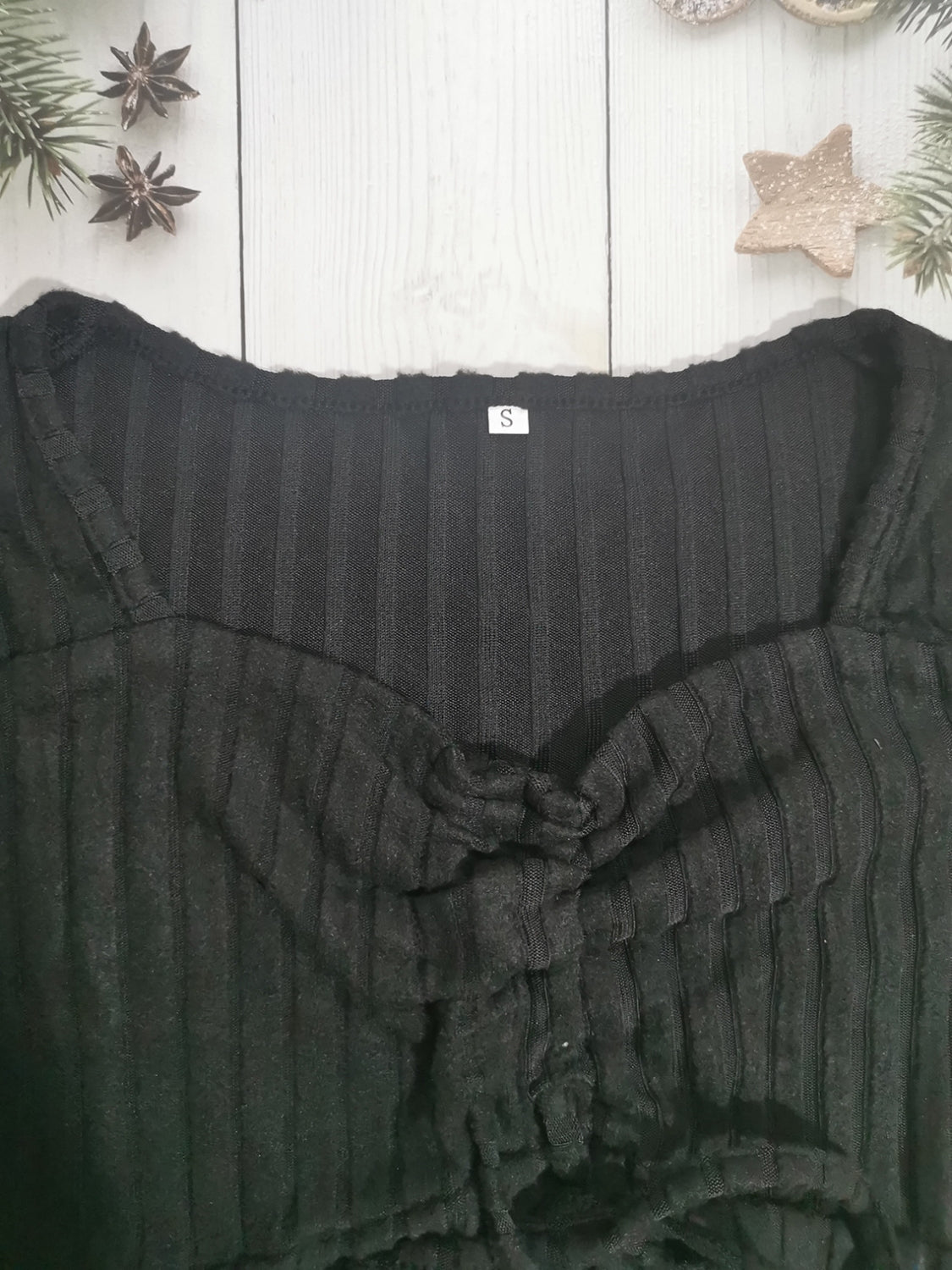 Drawstring ruched long sleeve ribbed top.