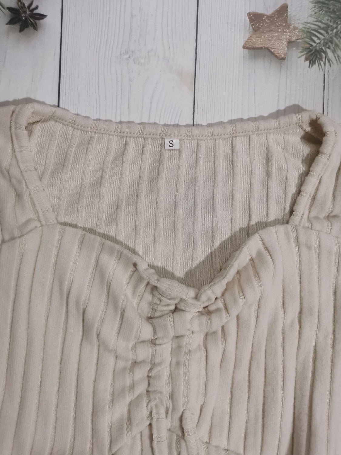 Drawstring ruched long sleeve ribbed top.