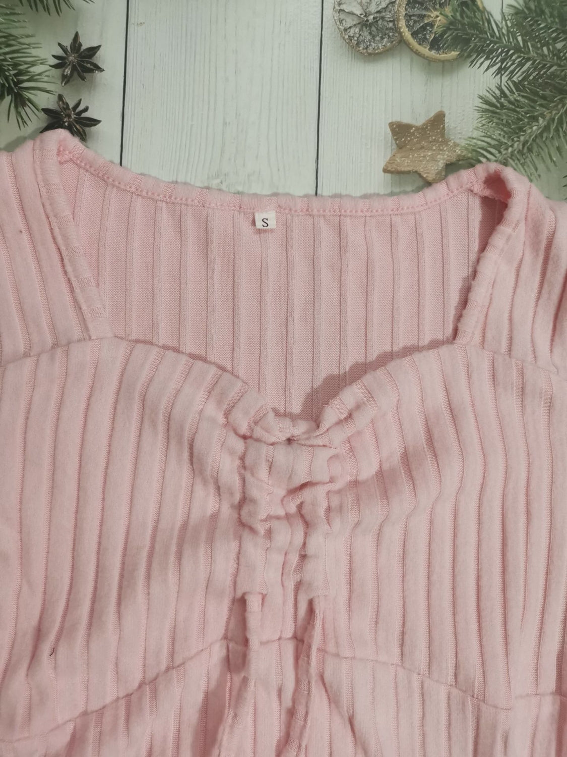 Drawstring ruched long sleeve ribbed top.