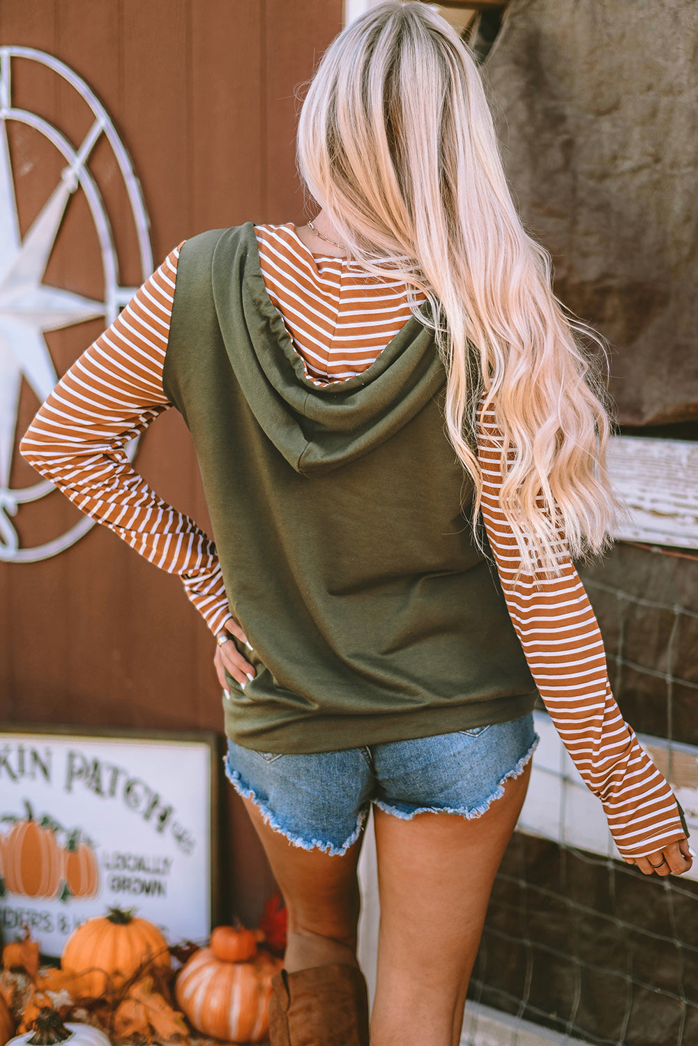 Drawstring stripe half zip long sleeve hoodie with pockets.
