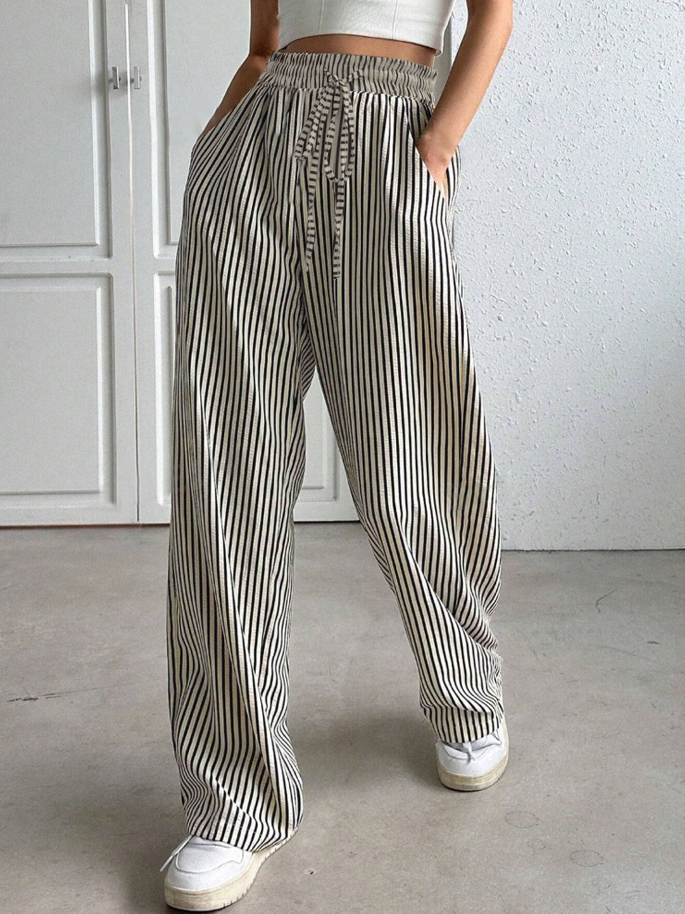 Drawstring striped elastic waist pants with pockets, opaque.