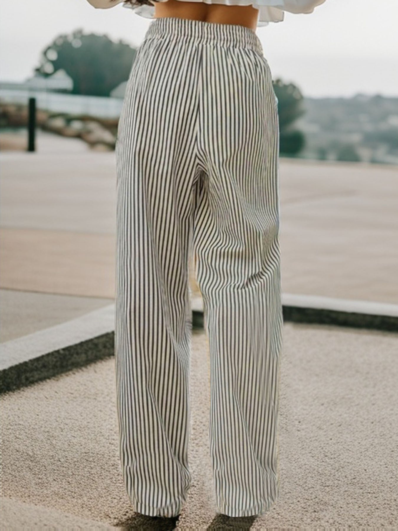 Drawstring striped elastic waist pants with pockets, opaque.
