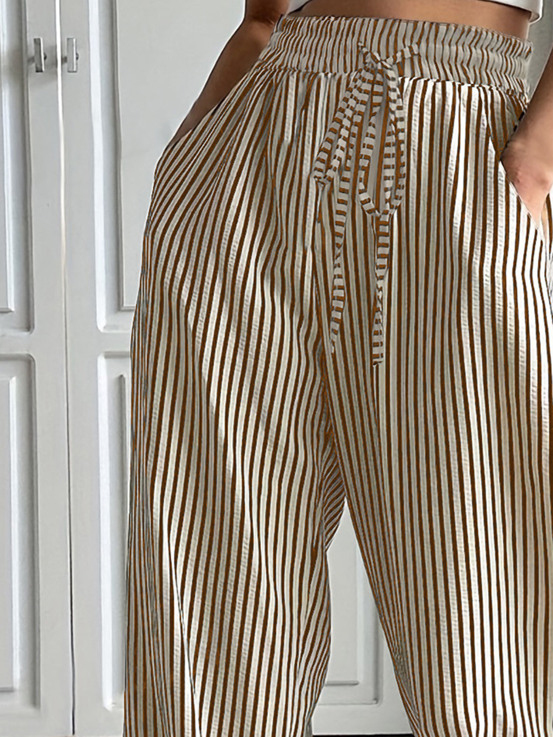 Drawstring striped elastic waist pants with pockets, opaque.