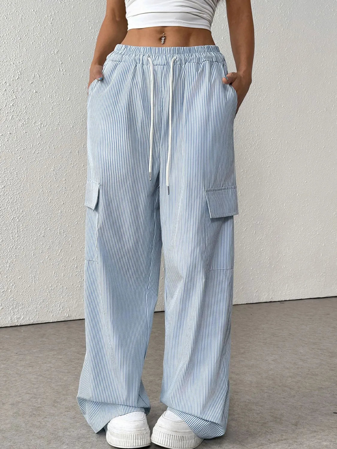 Drawstring striped wide leg cargo pants with pockets.