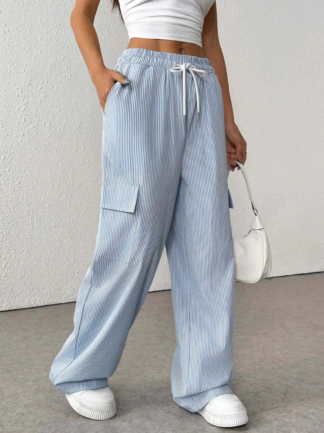 Drawstring striped wide leg cargo pants with pockets.