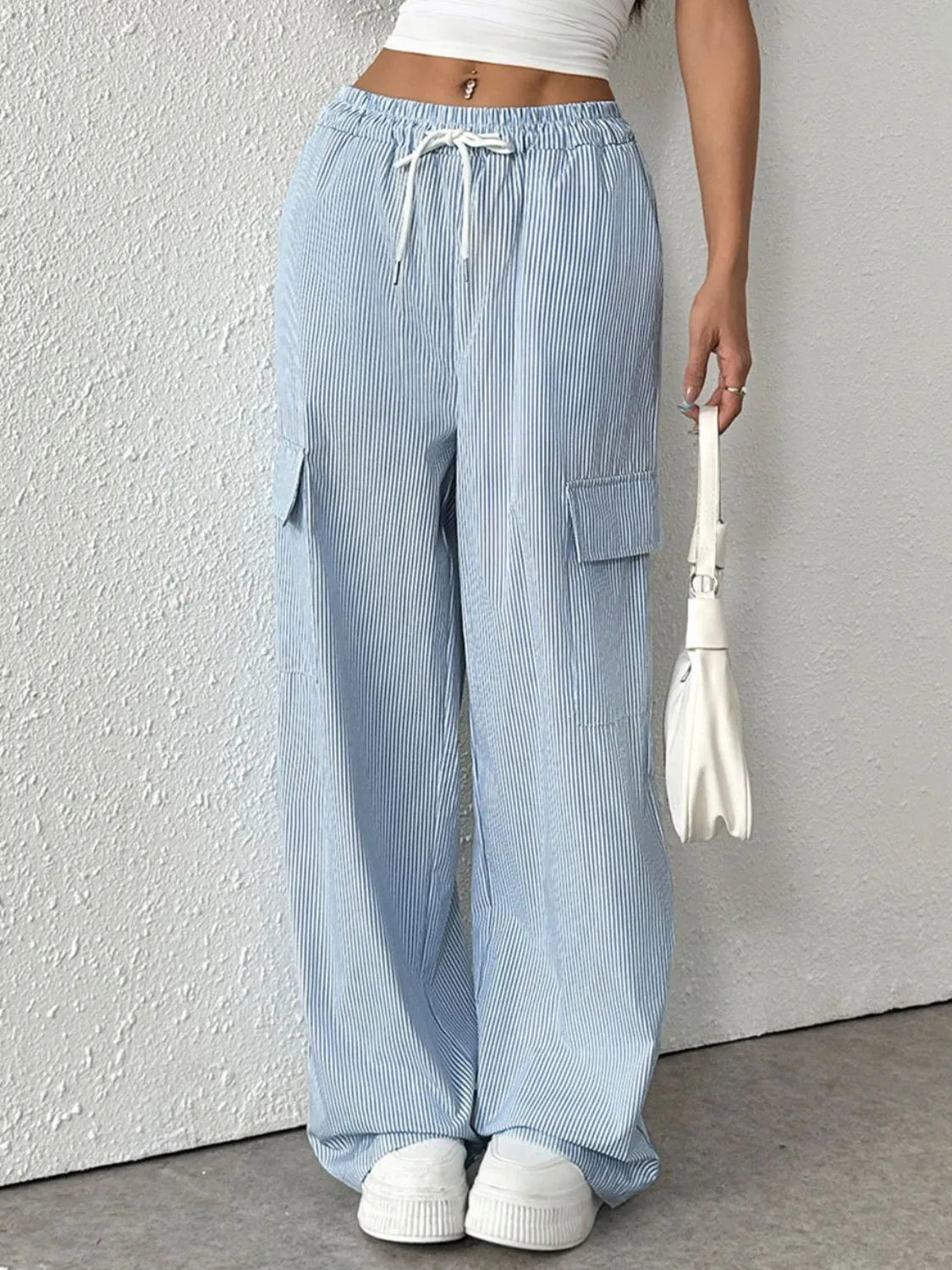 Drawstring striped wide leg cargo pants with pockets.