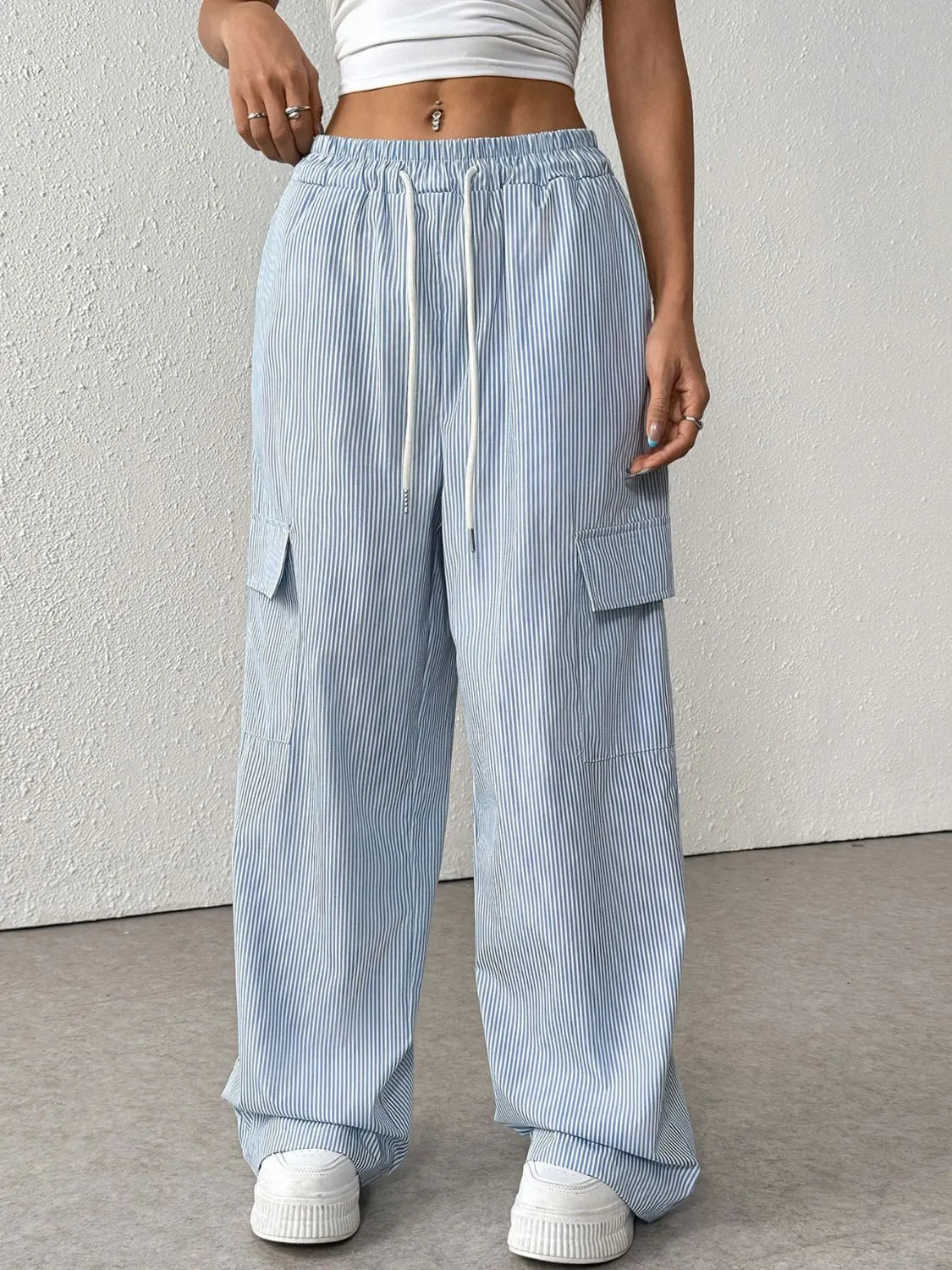 Drawstring striped wide leg cargo pants with pockets.