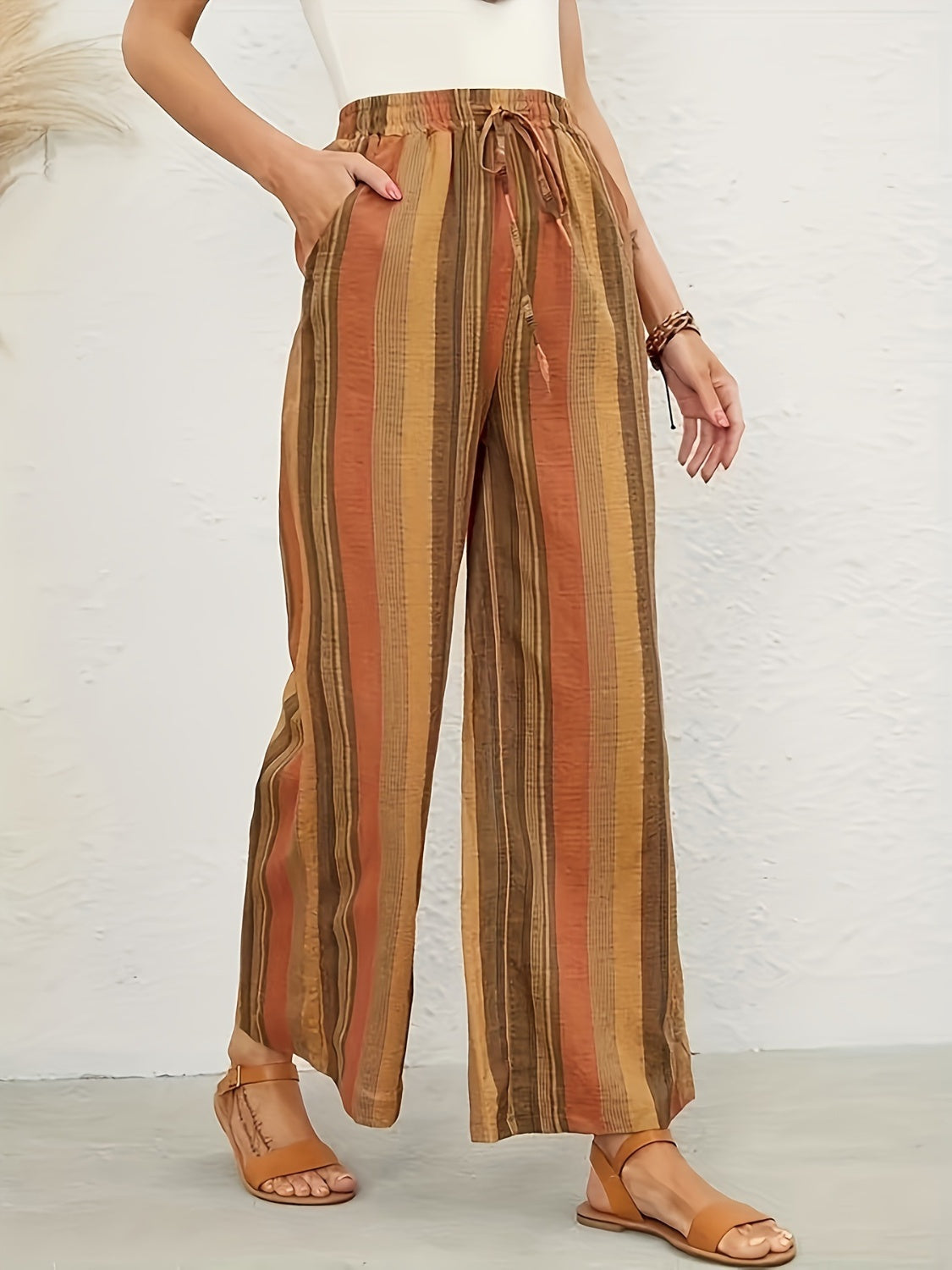Drawstring striped wide leg pants with pockets, opaque.