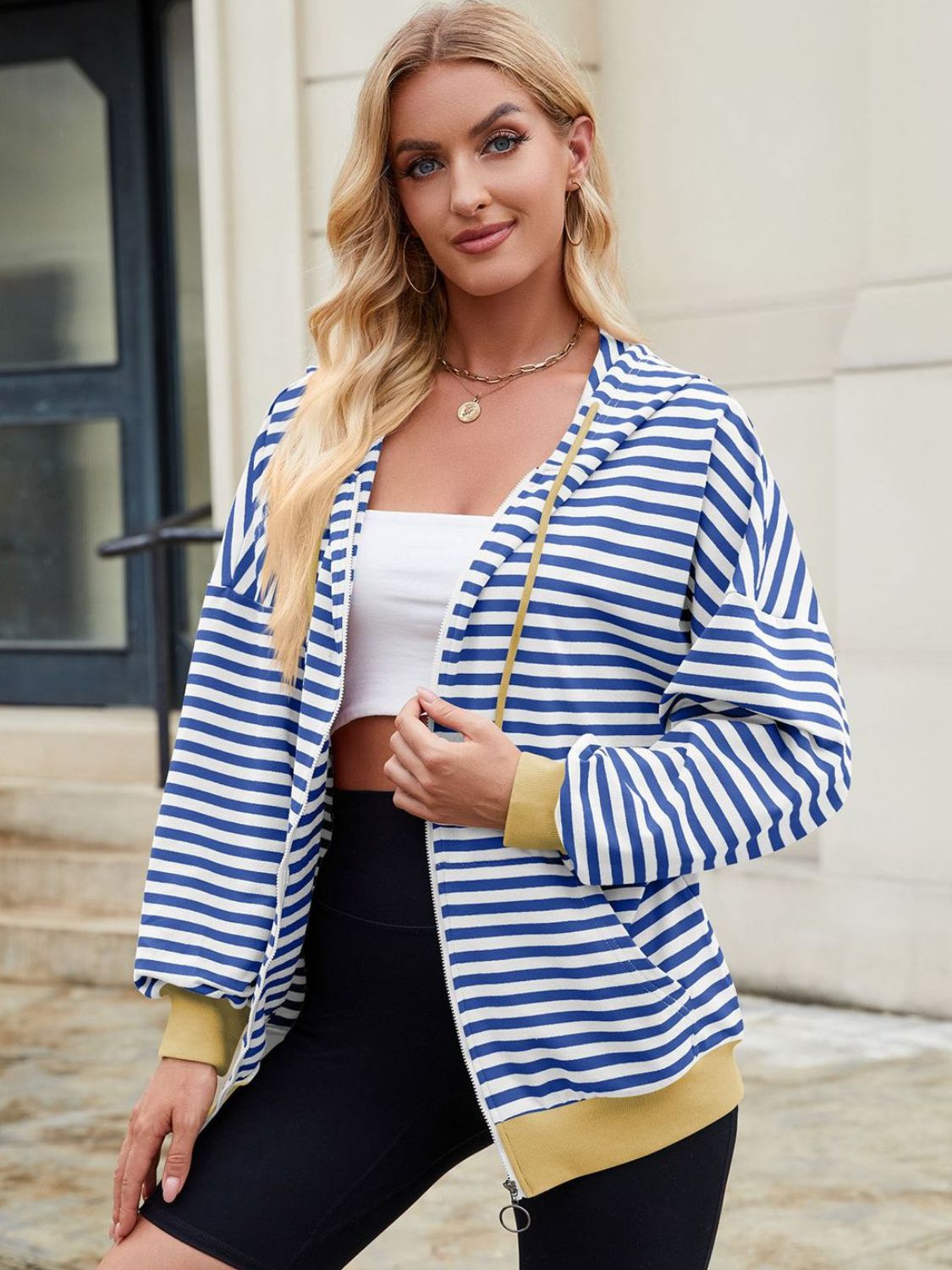 Drawstring striped zip up long sleeve hoodie with pockets.
