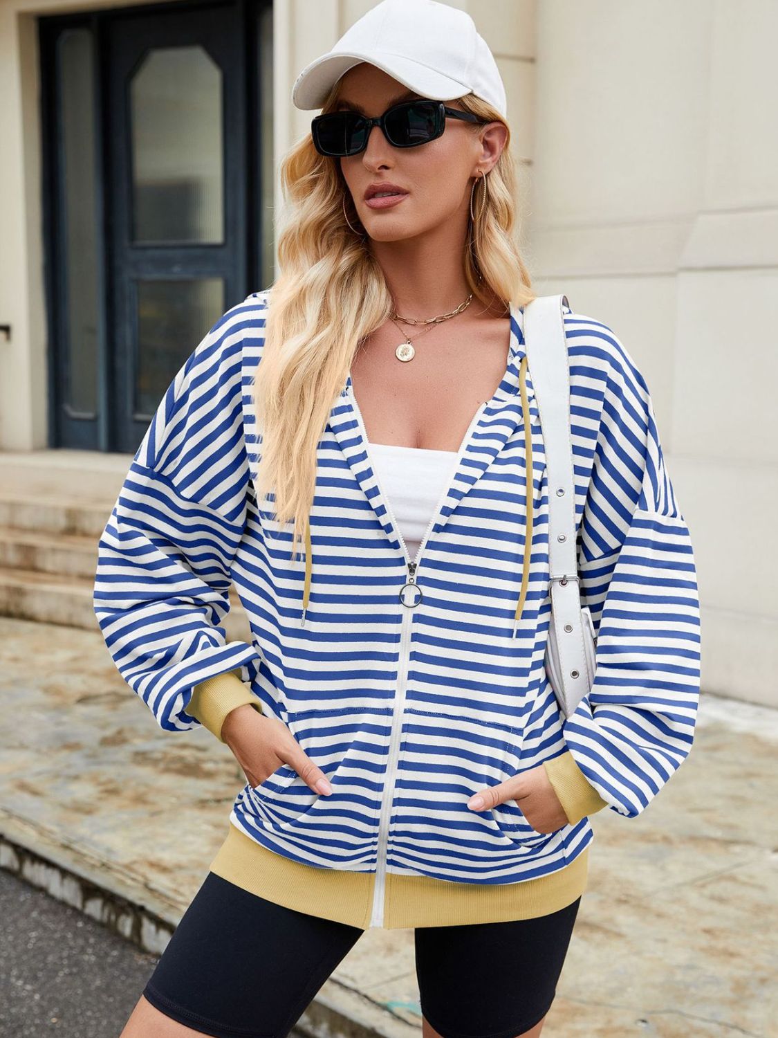 Drawstring striped zip up long sleeve hoodie with pockets.