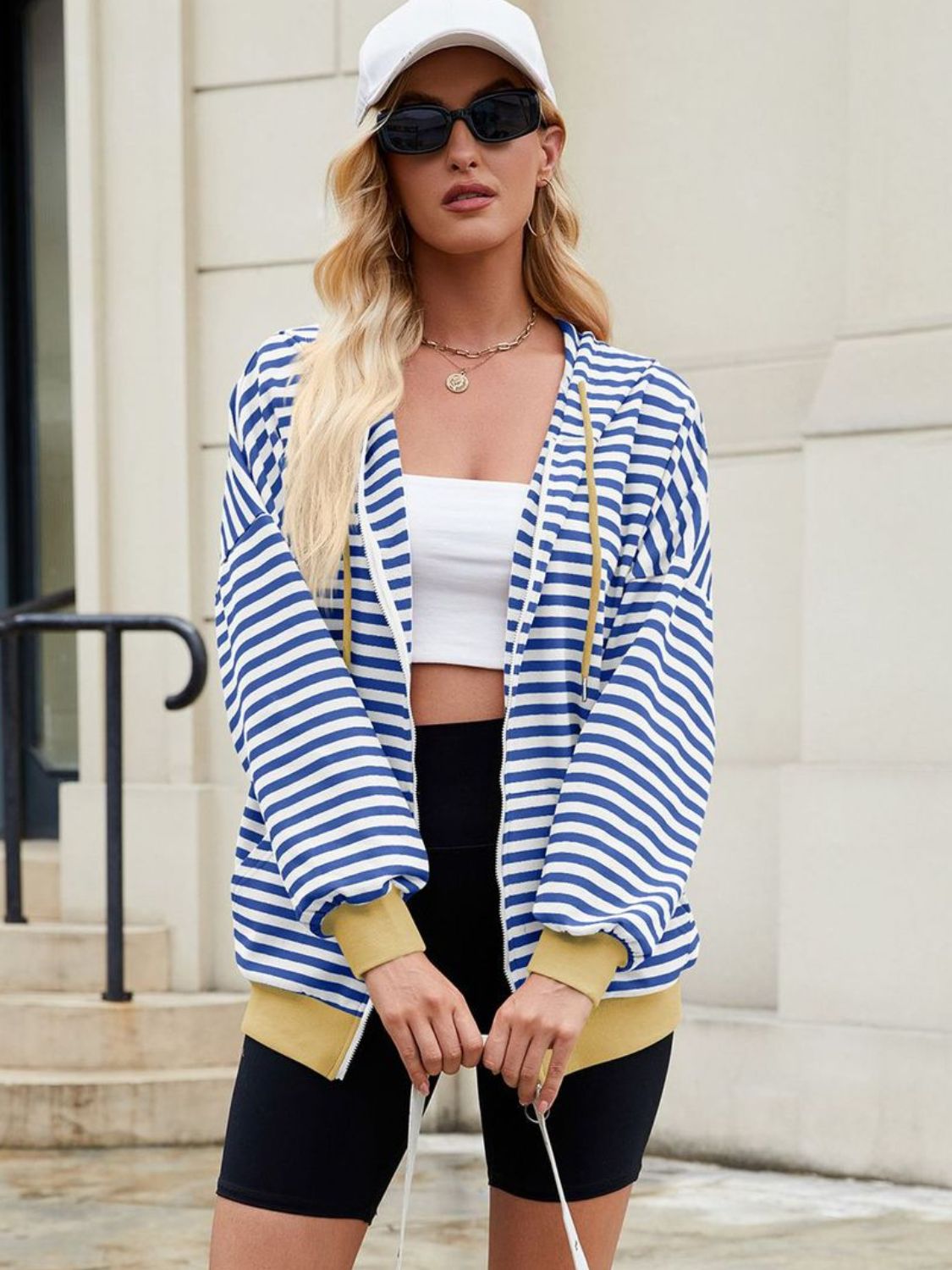 Drawstring striped zip up long sleeve hoodie with pockets.