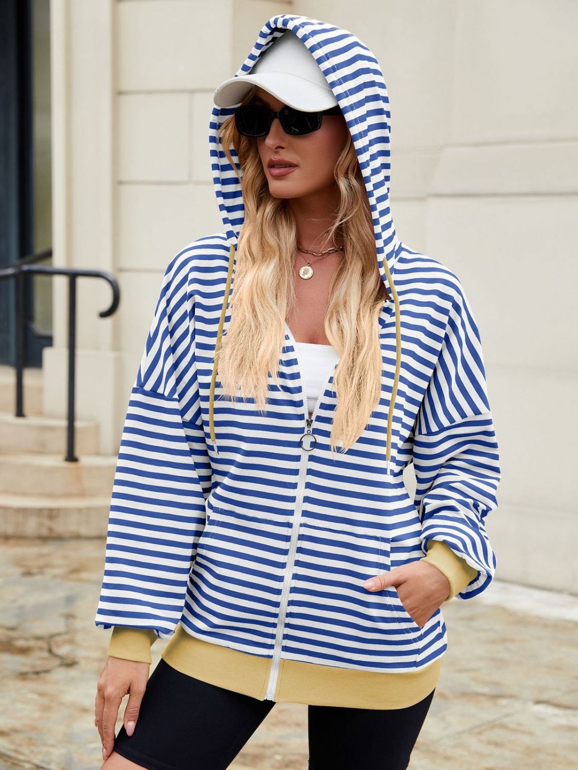 Drawstring striped zip up long sleeve hoodie with pockets.