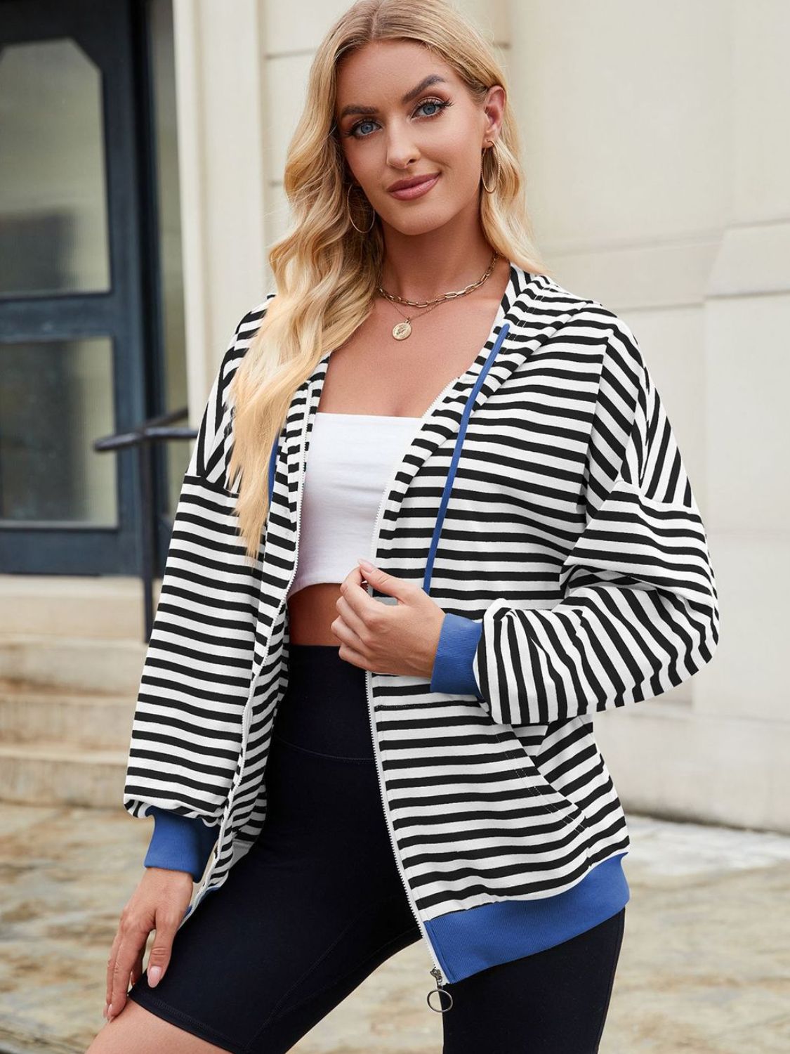 Drawstring striped zip up long sleeve hoodie with pockets.